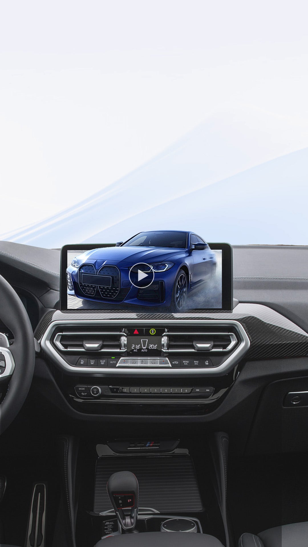 Car dashboard display playing video of blue BMW using Ottocast wireless CarPlay adapter for in-car entertainment